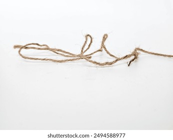 String bow isolated on white background. Jute rope bows, packaging cord knots, knotted rustic gift, eco-friendly natural rope bow.