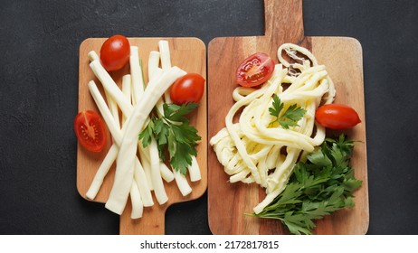 String Cheese Or Cheese Whip - Salty Snack Cheese With Cherry Tomatoes And Herbs On Chopping Board. Turkish Cheese