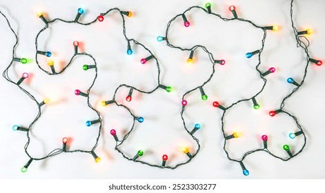 String of Christmas lights on white background. Colourful Christmas decoration.
 - Powered by Shutterstock