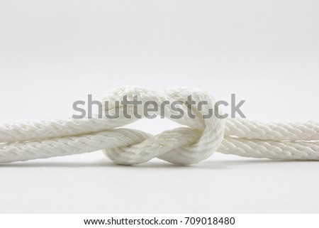 string knotted on a white background.