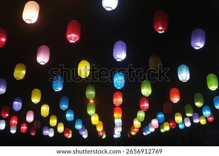 a string of lanterns at night.