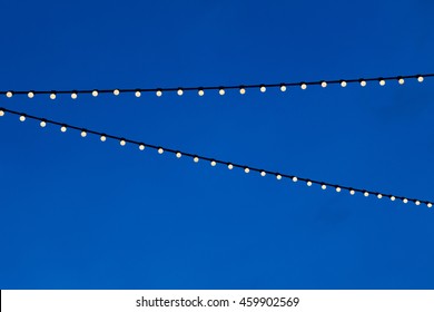 String Light Bulb  Hanging For Decorative Night Party And Blue Sky Background