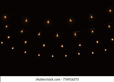 String Lights Glass Bulbs Garland With Glowing Spirals On Dark Black Background