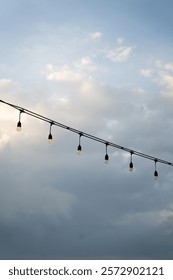 String of lights hanging in twilight sky