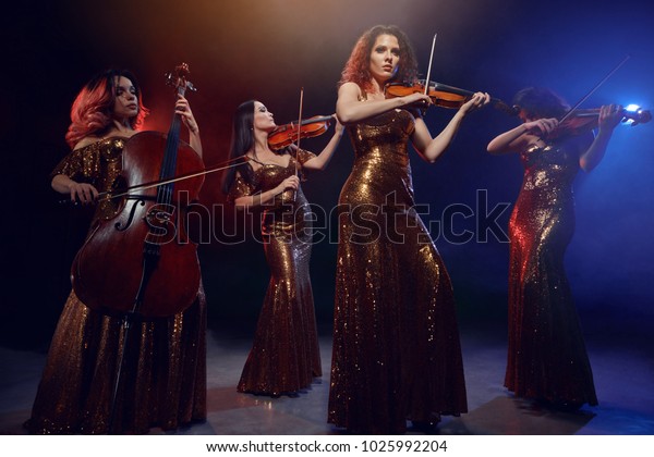 The string\
quartet performs on stage. Stage\
light.