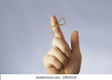 A String Tied Around An Index Finger