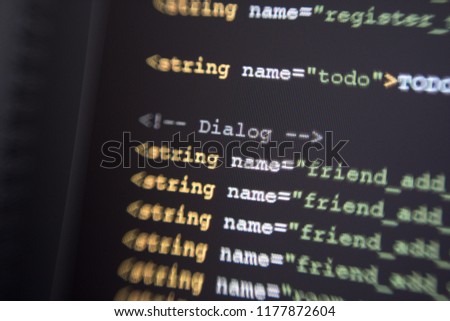String value xml tag for dialog class of java coding, development language, blur effect style, on black background.