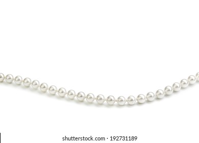String of white pearls forming a wave