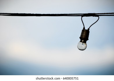 string wired of light bulb on blue sky background