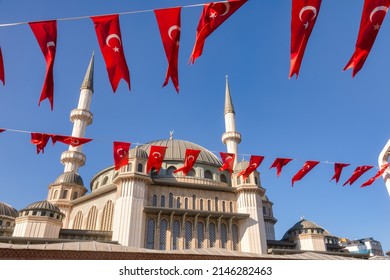 Strings of Turkish flag bunts festive decoration at Taksim Square, Istanbul, Turkey. Taksim Mosque (Taksim Camii) is seen in background