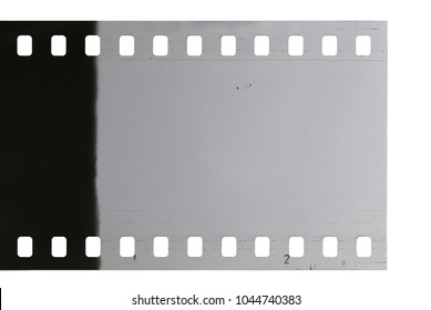 Strip of old celluloid film on white background
