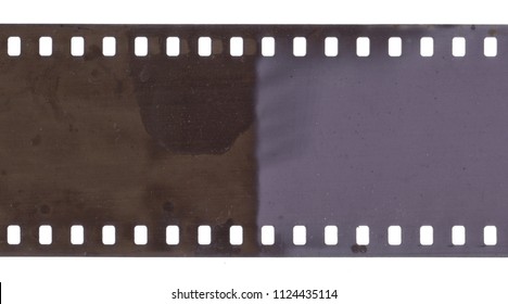 Strip of old film with dust and scratches isolated on white