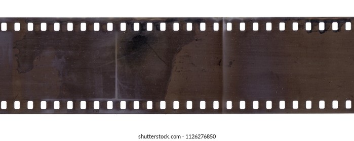 Strip of old film with dust and scratches isolated on white