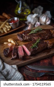 Strip Steak With French Fries And Onion Rings 