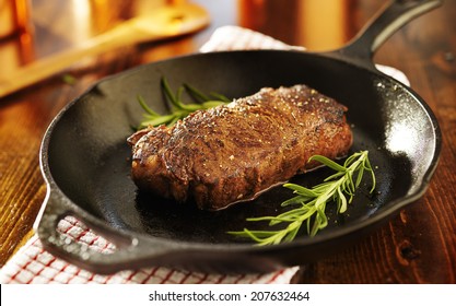 strip steak in iron skillet panoramic photo