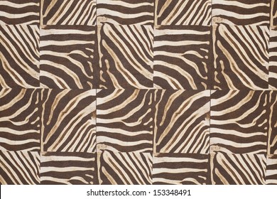 Striped animal pattern composed of square pieces of material