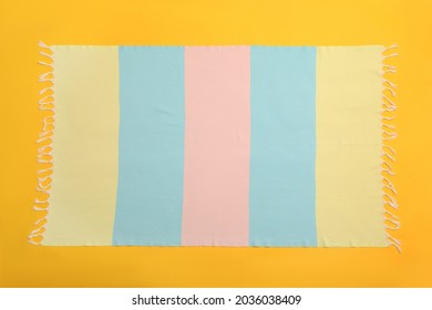 Striped Beach Towel On Yellow Background, Top View