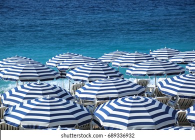Striped beach umbrellas. Nice, France. - Shutterstock ID 689336932