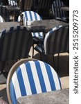 Striped Bistro Chairs and Tables in Outdoor Caf Setting