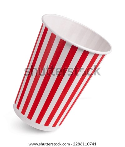 Striped empty popcorn bucket isolated on white background.