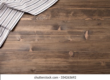 Striped Kitchen Towel From Left Top Corner Of Wooden Table Top View. Food Background.