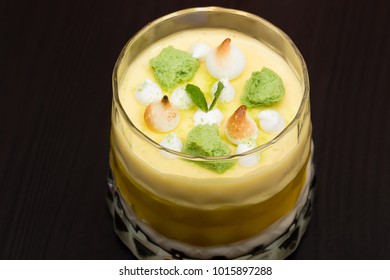 Striped Orange Jelly Glasses With Souffle And Cream Decorated By Mint