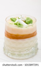 Striped Orange Jelly Glasses With Souffle And Cream Decorated By Mint