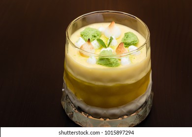 Striped Orange Jelly Glasses With Souffle And Cream Decorated By Mint