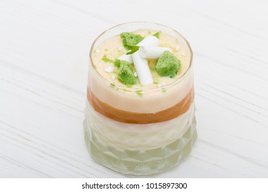 Striped Orange Jelly Glasses With Souffle And Cream Decorated By Mint