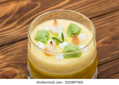 Striped Orange Jelly Glasses With Souffle And Cream Decorated By Mint