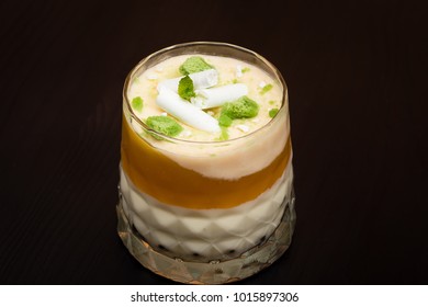 Striped Orange Jelly Glasses With Souffle And Cream Decorated By Mint