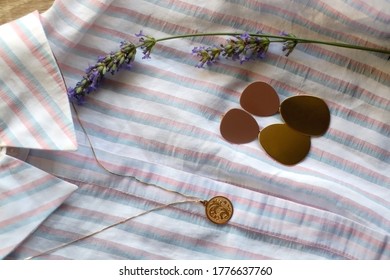 Striped Pastel Blouse, Gold Necklace With Vintage Pendant, Earrings And Lavender Flower. Top View.