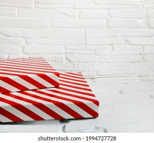 Striped rectangular catwalks in red and white on a white background. A trendy showcase for all products.