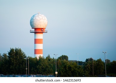 Striped Weather Radar Tower At An Airport