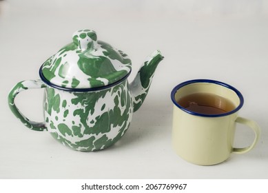Stripes Vitreous Enamel Teapot And Glass Isolated On White Background
