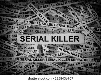 Strips of newspaper with the words Serial Killer typed on them. Black and white. Close up.
