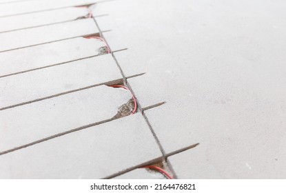 Strobe Line In Cement Screed For Laying Red Electric Cable For Underfloor Heating.