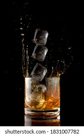 Stroboscopic effect. Whiskey splash with ice cube.