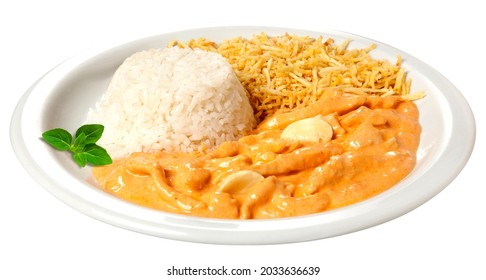 Stroganoff with straw potatoes, rice and mushrooms on wooden background.