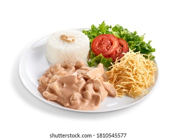 Strogonoff Executive Dish of Chicken, Rice, Salad and Straw Potatoes. Isolated whit path
