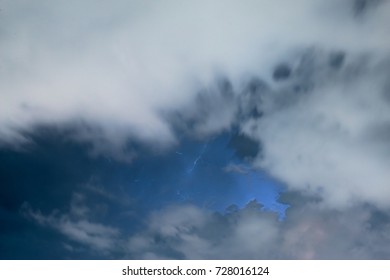 Stroke of lightning with storm clouds
