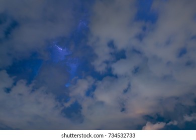 Stroke of lightning with storm clouds