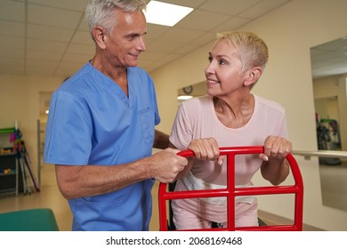 Stroke Patient Using Walking Frame In Medical Clinic