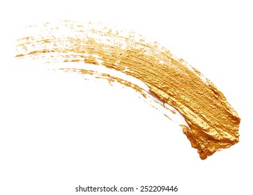 Strokes of golden paint isolated on white background