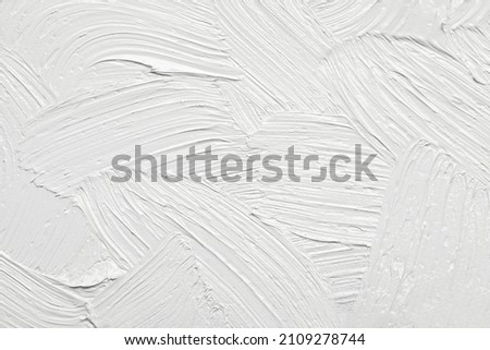 Strokes of white oil paint as background, closeup