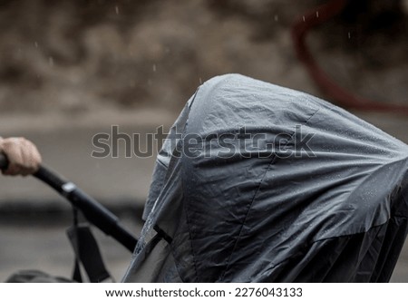 stroller cover used during rain in the city