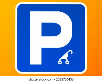 Stroller Reserved Parking Sign. Blue sign on a yellow background with an image of a baby stroller. Push chair modern sign. Parents with prams parking zone. Space for women with children, toddlers only