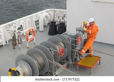 STROMNESS, SCOTLAND – SEPTEMBER 27, 2017: Northlink ferry worker on deck prepares for the crossing from Orkney to Scrabster on September 17, 2017.