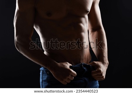 Strong abs, dark studio and person with training development, body transformation goals and muscle building. Bodybuilder strength, stomach exercise and fitness model motivation on black background
