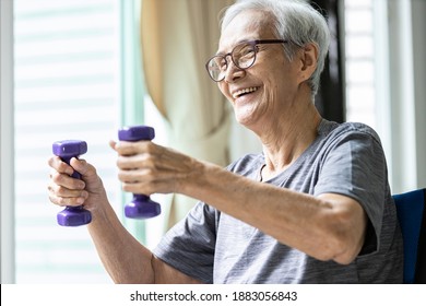 Strong Asian Senior Woman Working Out,lifting Dumbbell Weights For Strength Training,old Elderly Using Dumbbells While Exercising,physical Therapy In Nursing Home,health Care,healthy Lifestyle Concept